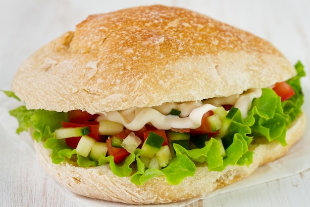 Sandwich with lettuce, tomato and cucumber