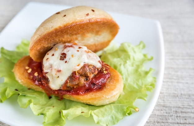 Sandwich with meatball in tomato sauce and mozzarella