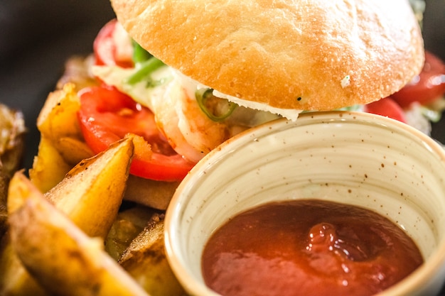 sandwich with potatoes on a plate in a cafe