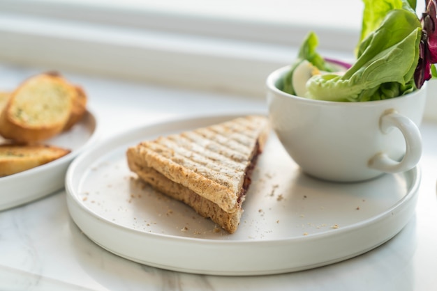 sandwich with salad on plate