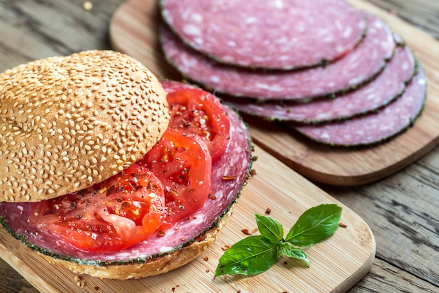 Sandwich with salami and tomatoes