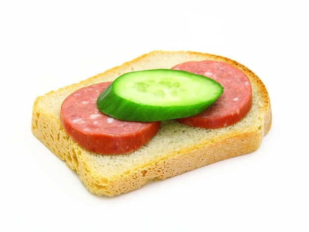 Sandwich with sausage and a cucumber