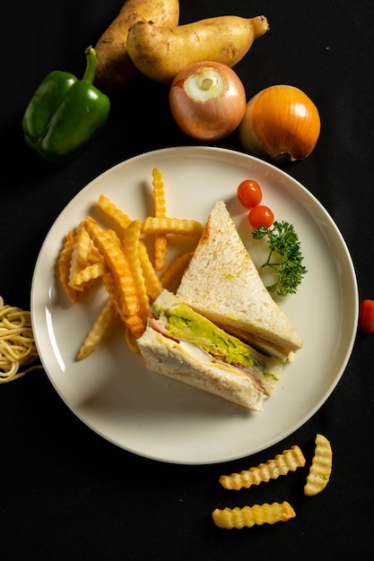 Sandwiches and french fries in a white plate