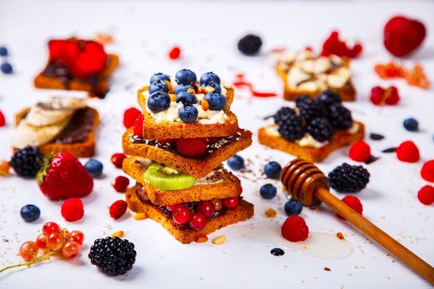 Sandwiches set sweet with cream-cheese and fresh berries and fruit