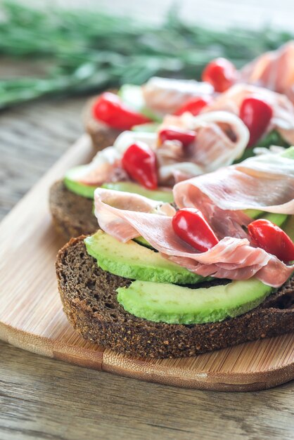 Sandwiches with avocado and prosciutto