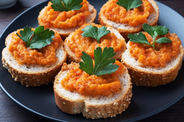 Sandwiches with bread zucchini caviar tomatoes onions. Homemade vegetarian food. Canned stewed vegetable. wooden surface close up