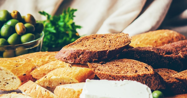 Sandwiches with cheese and olives. Selective focus.