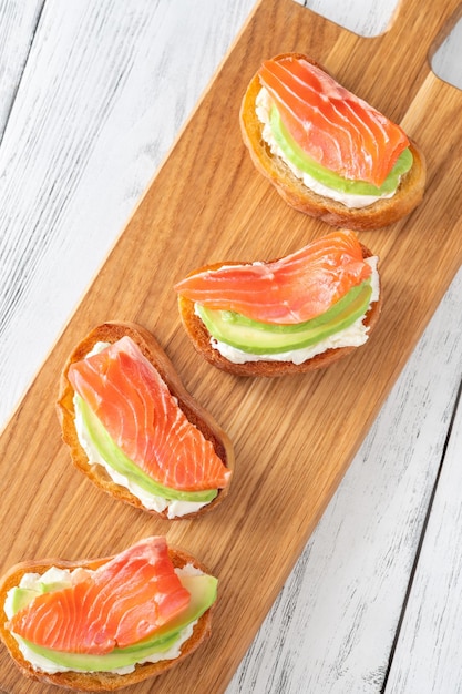 Sandwiches with cream cheese avocado and salmon