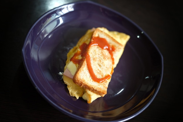 Sandwiches with egg ham and toast cheese fried in dish