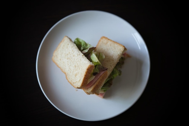 Sandwiches with egg ham and toast cheese fried in white dish