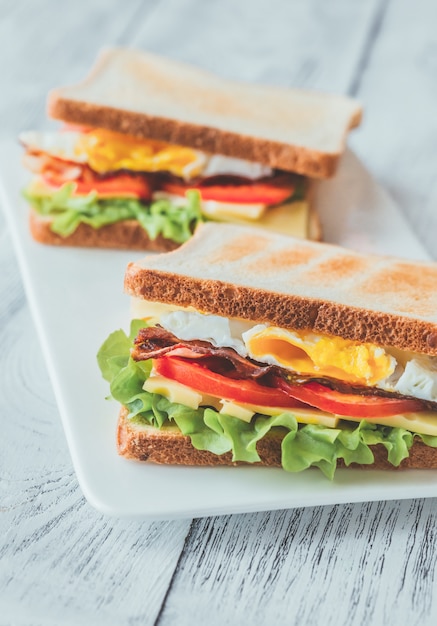 Sandwiches with fried egg and bacon