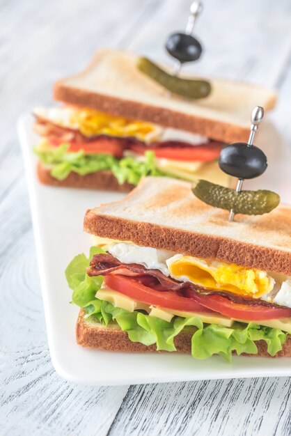 Sandwiches with fried egg and bacon