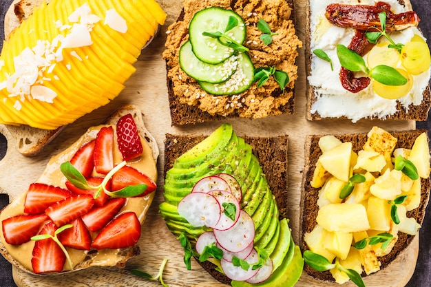 Sandwiches with mango, strawberry, tofu pate, avocado, potatoes and ricotta 