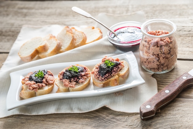 Sandwiches with pate and berry jam