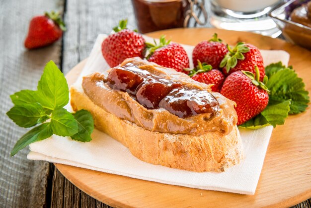 Sandwiches with peanut butter, jam and fresh fruits