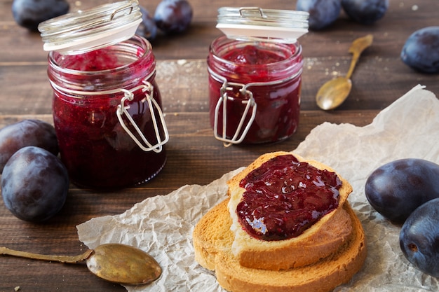 Photo sandwiches with plum jam and jars