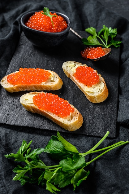 Sandwiches with salmon red caviar.  