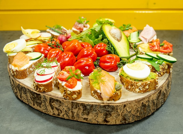 sandwiches on a wooden tray close up