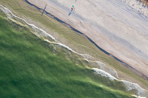 sandy beach on the seashore view from above summer background