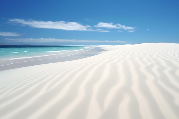 Photo a sandy beach with blue water and blue sky