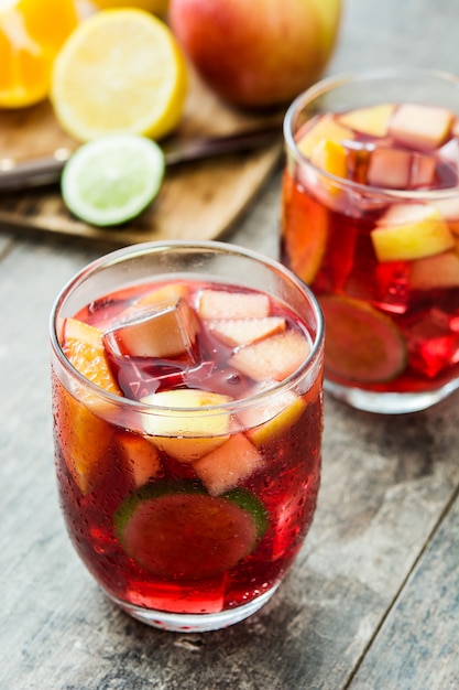 Sangria drink in glass on wooden table
