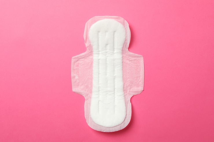 Photo sanitary pad on pink surface