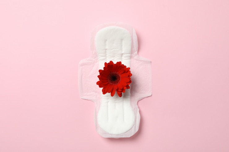 Photo sanitary pad with gerbera on pink surface