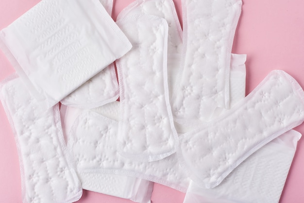 Sanitary pads on a pink background