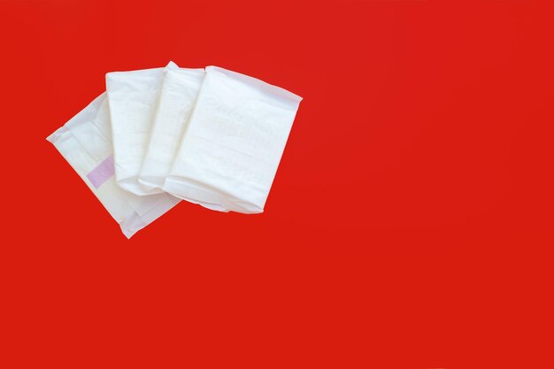 Sanitary pads on red background