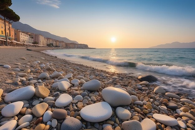 Photo sanremo riviera dei fiori liguria italy scenis rocks and pebbles on beach illuminated beautiful by sunset lig