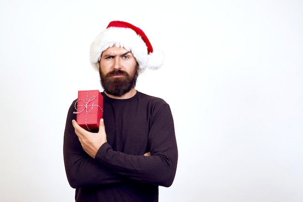 Santa christmas guy on white holding and opening gift, present