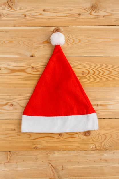 Santa Christmas hat on a wooden background