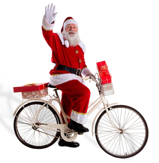 Santa Claus on bicycle delivering Christmas gifts.