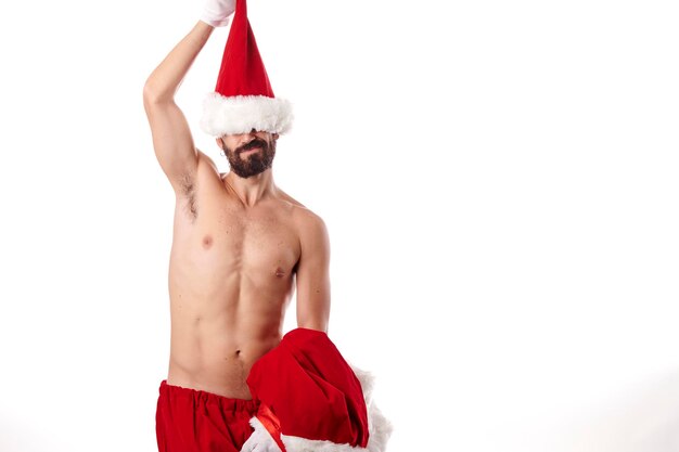 Santa claus bodybuilder showing off his athletic body on a white background