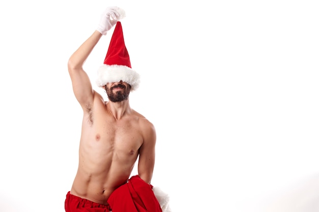 Santa Claus bodybuilder showing off his sexy athletic body on a white background