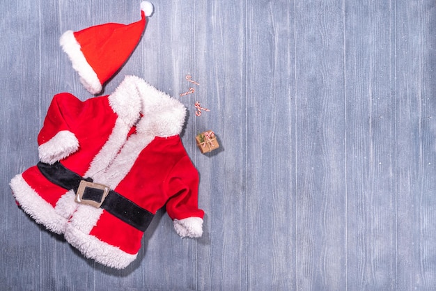 Santa Claus costume on wooden background