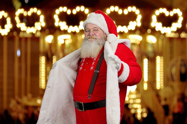 Santa Claus demonstrating his suit.