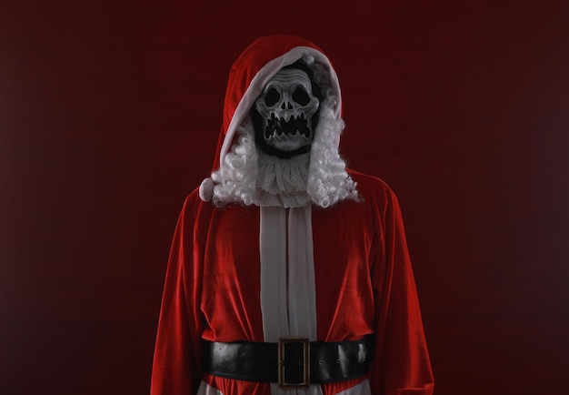 Photo santa claus devil on a red background