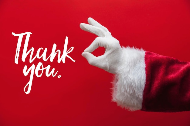 Santa Claus hand okay gesture with a festive message