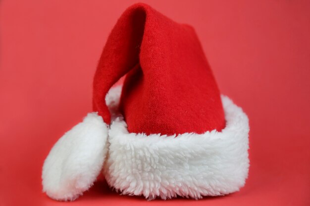 Santa Claus hat against red background