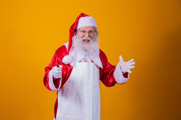 Santa Claus holding a knife. Evil Santa Claus concept. Murder.