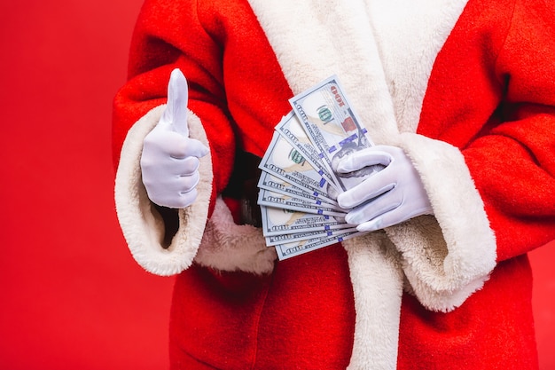 Photo santa claus holding money