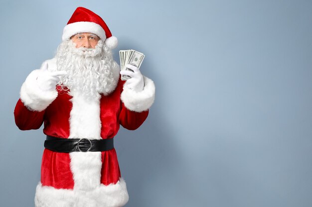 Santa Claus holding money