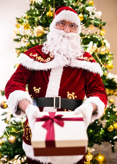 Santa Claus holding a present