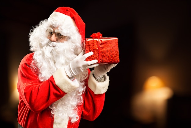 Santa Claus holding a present