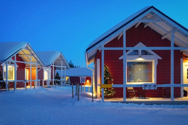 Santa Claus Holiday Village House, Lapland, Finland, on Arctic Circle in winter. After sunset