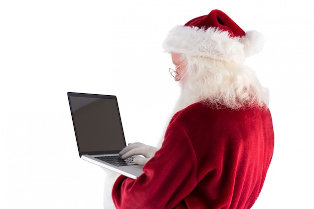 Santa Claus maakt gebruik van een laptop