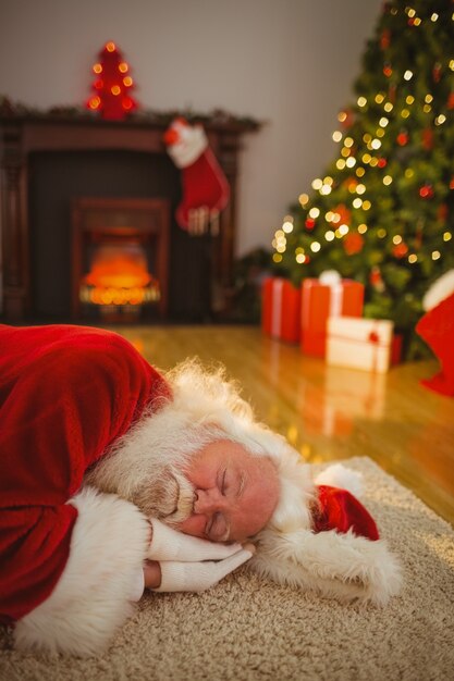 Santa claus napping on the rug