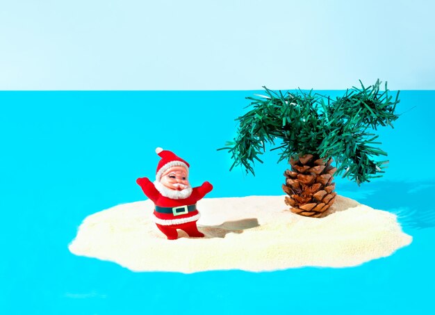 Santa Claus and palm tree on tropical beach Christmas holiday concept Happy New Year background