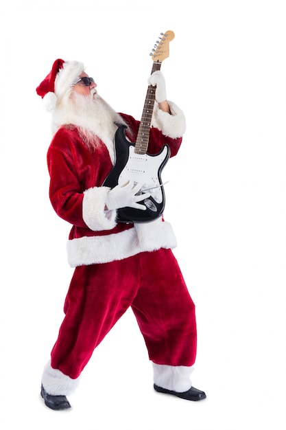 サンタクロースはサングラスでギターを演奏する